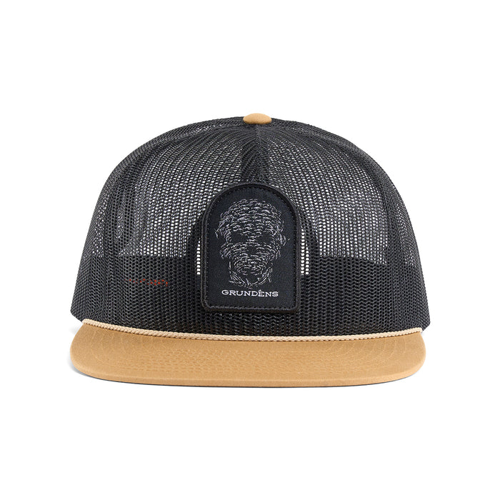 Black mesh trucker hat with a tan brim and a logo patch featuring a graphic design on the front.