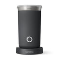 Black milk frother with silver top on a white background