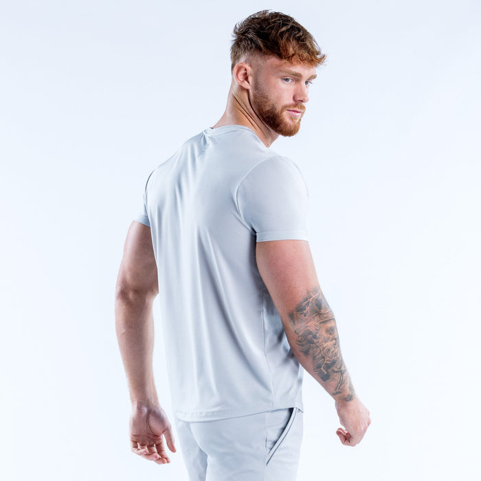 Light blue performance crew-neck T-shirt side view, short sleeves and curved hem