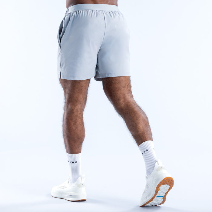 Light blue training shorts from back view, elastic waistband, 6-inch inseam