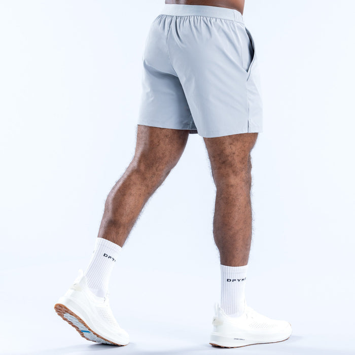 Light blue athletic training shorts, back view with stitched panel details