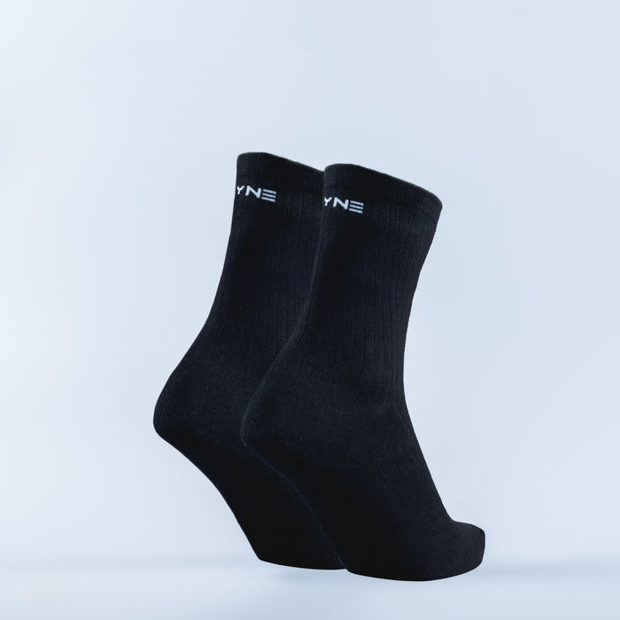 Black crew socks with YN logo at the cuff, ribbed knit.