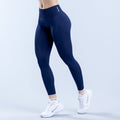 Navy blue high-waist compression leggings, ankle length, subtle logo at waistband