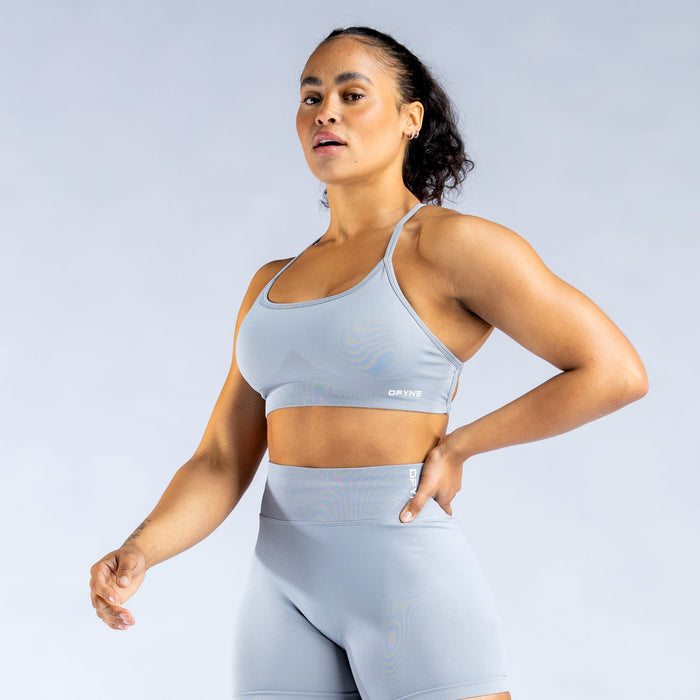 Light blue backless sports bra with racerback straps and supportive front band