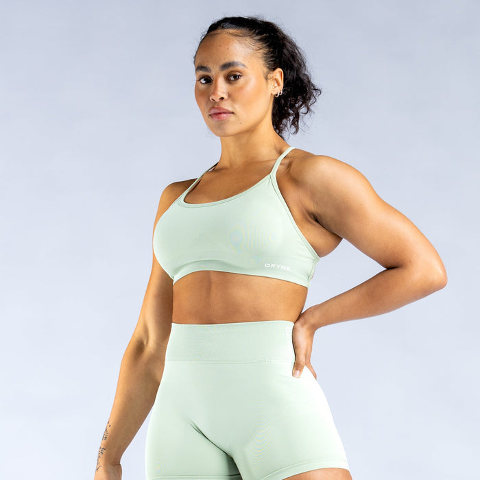 Mint green backless sports bra with crisscross open-back straps
