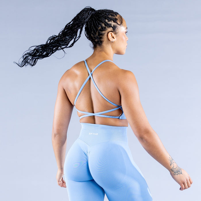 Light blue sports bra, open back with crisscross adjustable straps