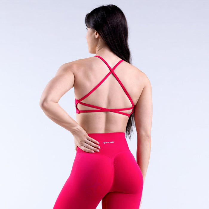 Backless sports bra, crisscross back straps and scoop neckline, bright pink