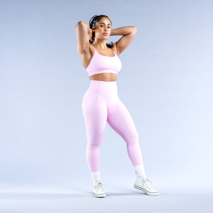 Light pink sports bra with scoop neckline and wide support straps