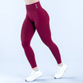 Burgundy dynamic leggings with logo waistband and tapered full-length fit