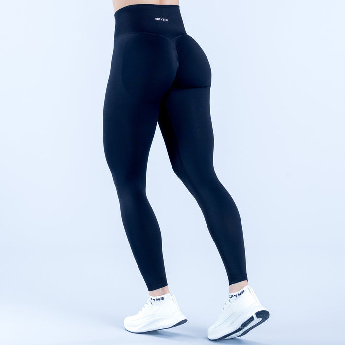 Black performance leggings, back view, logo waistband and contoured seams