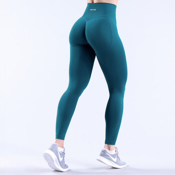 Teal high-waist leggings with curved back yoke detail and fitted legs