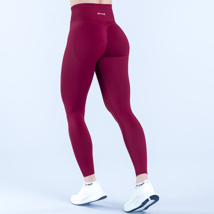 Burgundy dynamic leggings with high-rise waistband and smooth stretch fabric