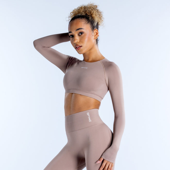 Taupe long-sleeve crop top with crew neck and curved cropped hem.