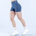 4.5-inch performance shorts, navy blue, side view with small thigh logo