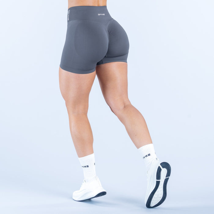 Dark gray 4.5-inch performance shorts, back view with snug fit and printed logo.