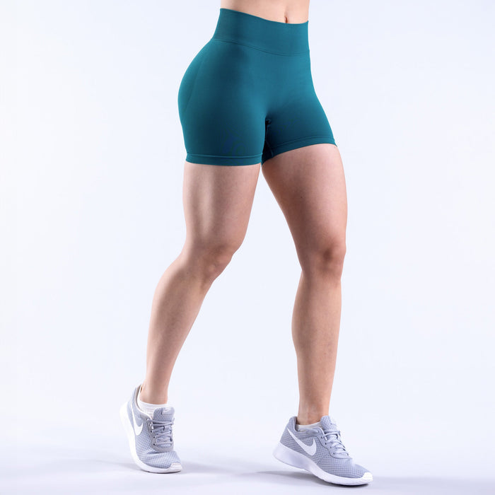 Women's teal 4.5-in athletic shorts, back-and-side view with stretch fabric
