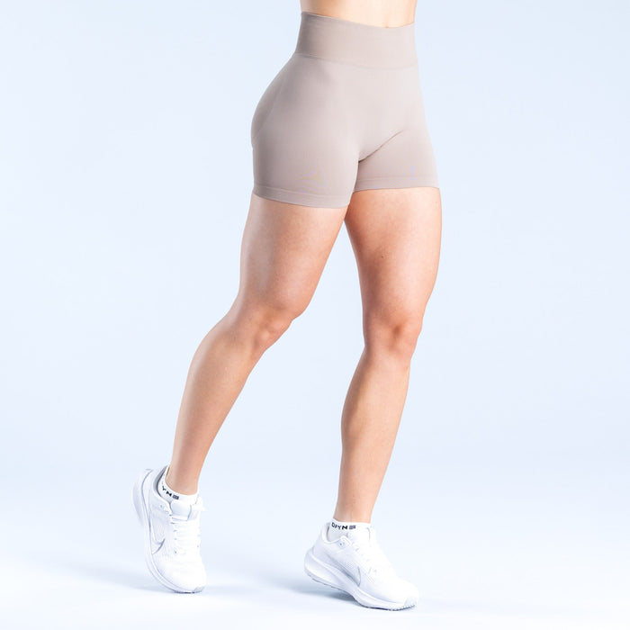 Women's taupe 4.5-inch athletic shorts, front three-quarter view, flat waistband