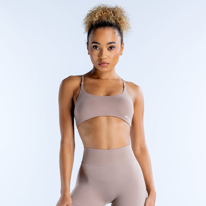 Taupe sports bra with scoop neckline and thin adjustable straps