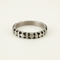 Silver-tone hand-carved band ring with raised diamond-cut pattern across the band