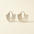 Hand cut hoop earrings with stacked curved lines and hinged backs, silver-tone finish