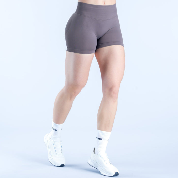 Impact shorts, 4.5-inch fitted compression, dark gray, front/side view with clean hem.