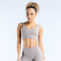 Light gray sports bra with wide racerback straps and scoop neckline