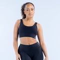 Black racerback sports bra with wide bottom band, medium support