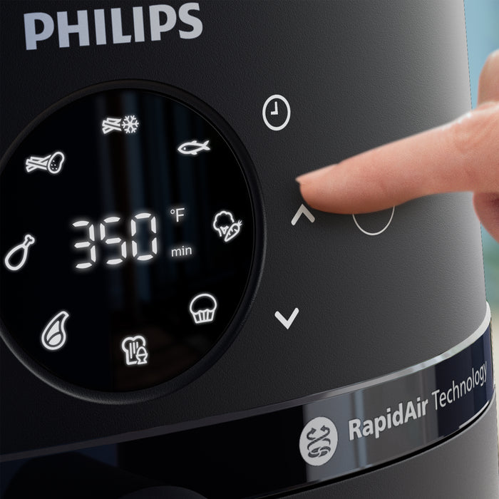 Philips kitchen appliance with digital display and RapidAir Technology branding.