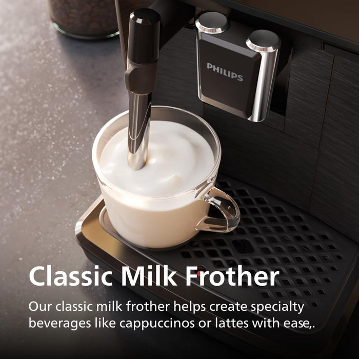 Philips milk frother in action with a cup of frothed milk on a coffee machine.