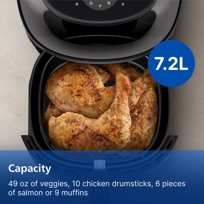 Air fryer with roasted chicken and text indicating capacity, shown on a light background.