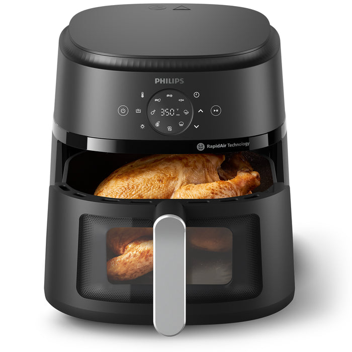 Philips 230 air fryer with food inside on a white background