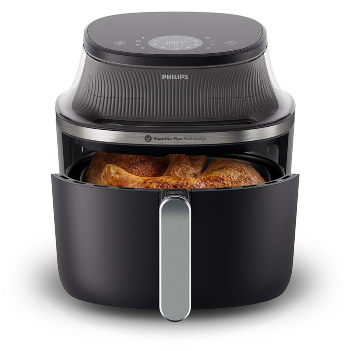 Philips air fryer with food inside on a white background