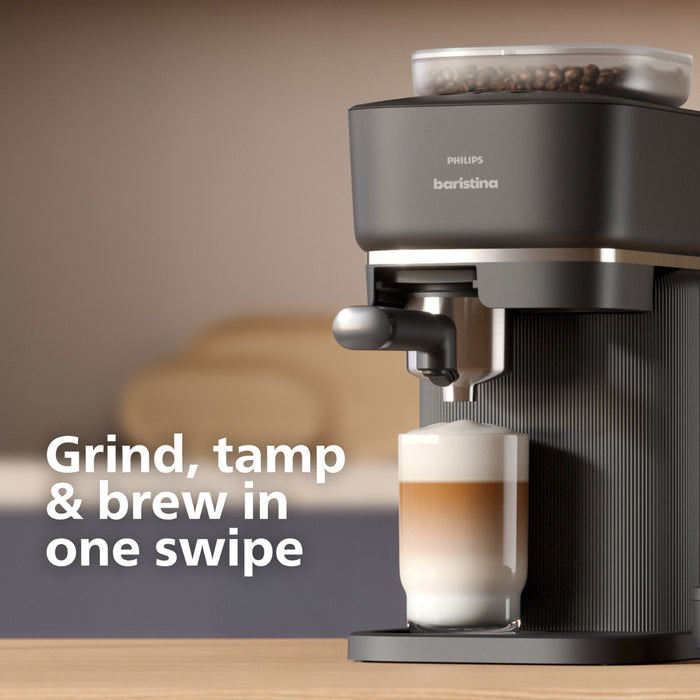 Philips Barista coffee machine with a glass of coffee on a wooden surface.