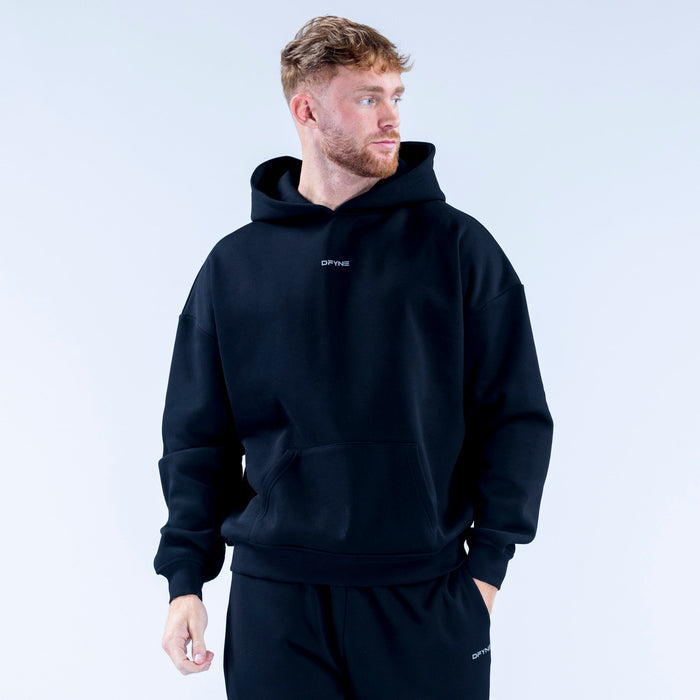 Black pullover hoodie with hood and front pocket, small chest logo