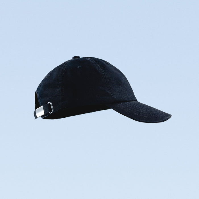 Navy baseball cap with adjustable buckle strap and curved brim