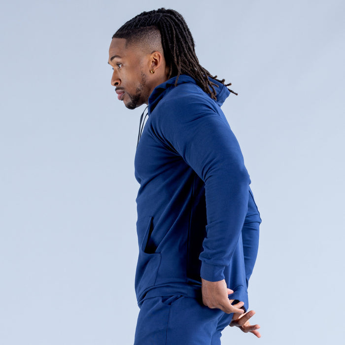 Royal blue hoodie side view with drawstring hood and ribbed cuffs