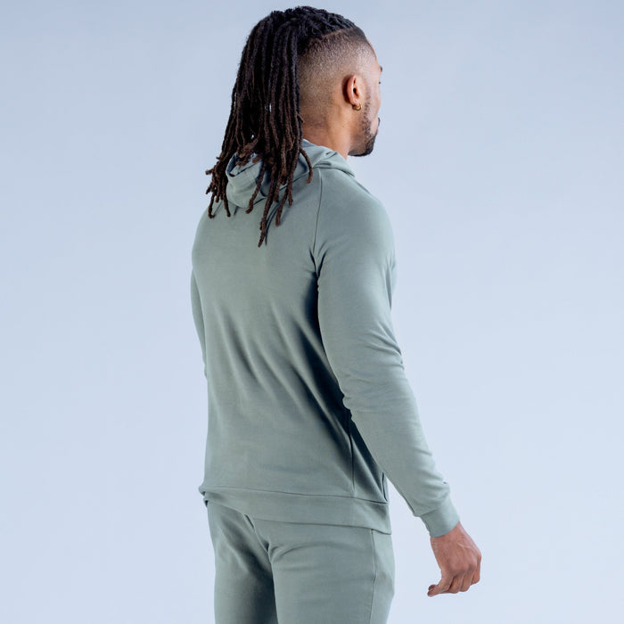 Sage green hoodie rear view with kangaroo pocket and ribbed cuffs