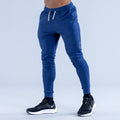 Blue tapered jogger pants with elastic cuffs and white drawstring waist
