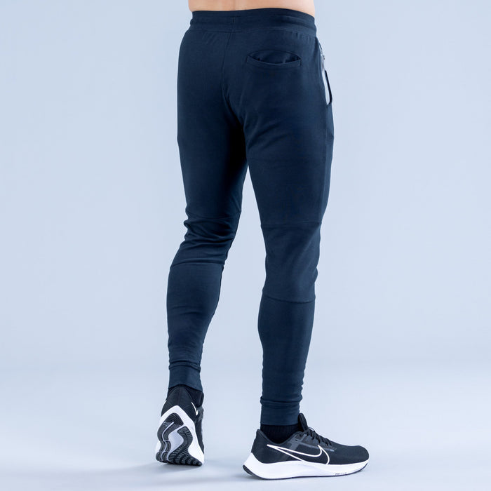 Dark navy tapered jogger pants with elastic waistband and side pockets
