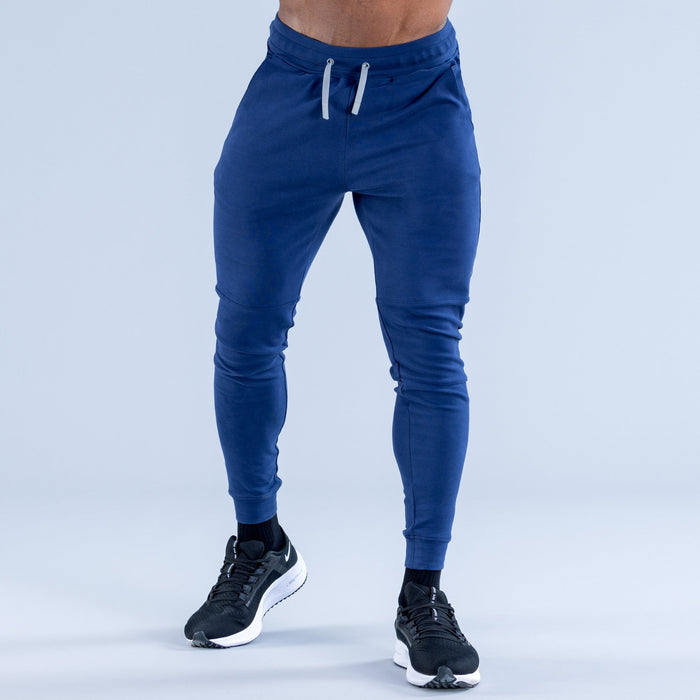 Blue tapered jogger pants with front drawstring and slim tapered legs
