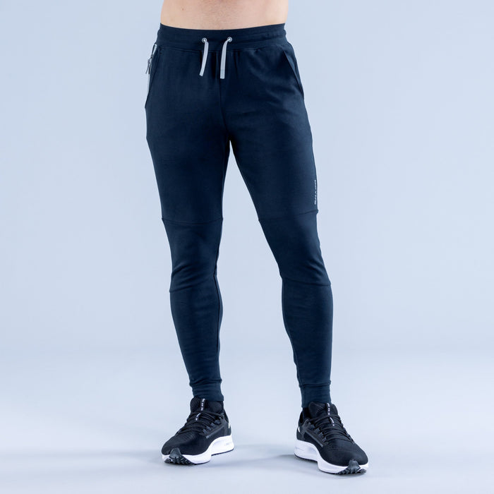 Dark navy tapered jogger pants, drawstring elastic waist, cuffed ankle