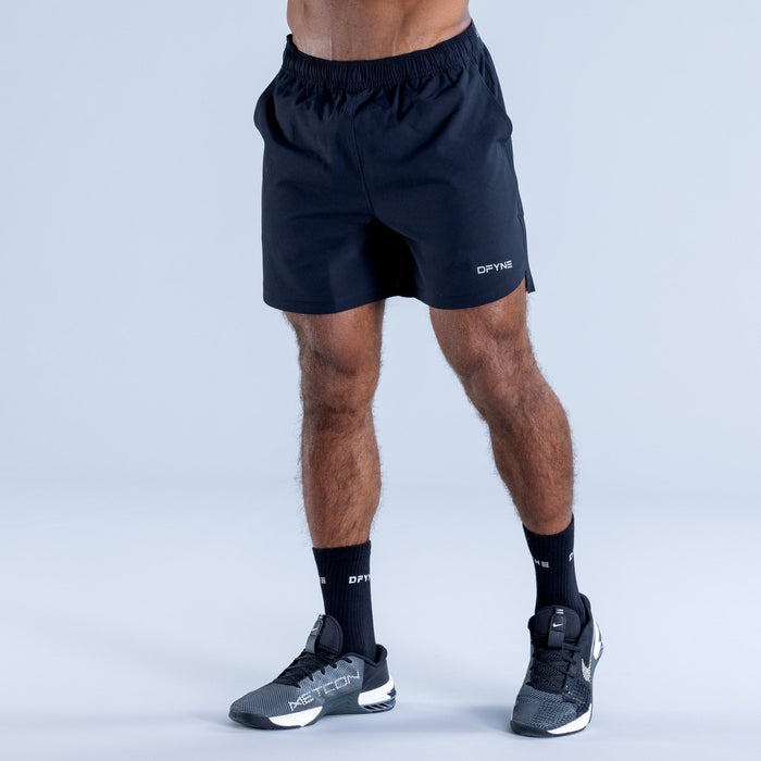 Dark navy training shorts with elastic waistband and side seams