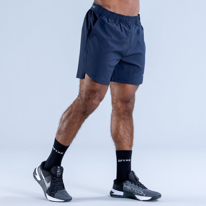Navy training shorts with elastic waistband and side pocket detail, side view