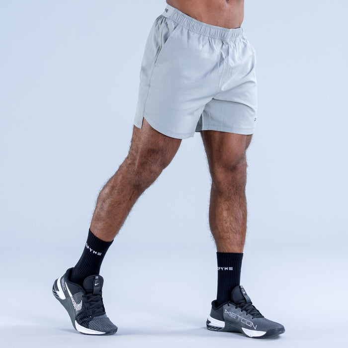 Men's light blue training shorts with side pocket opening and DPYNE logo