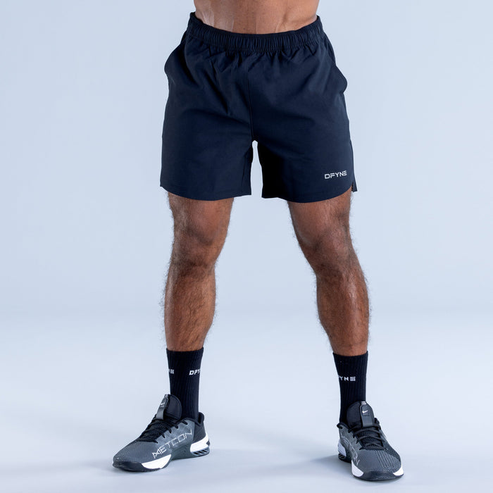 Dark navy training shorts with elastic waistband and DFYNN logo on leg