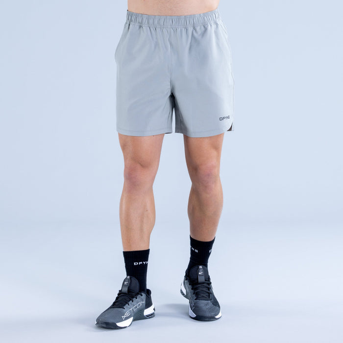 Men's light blue training shorts with straight hem and DPYNE logo near thigh