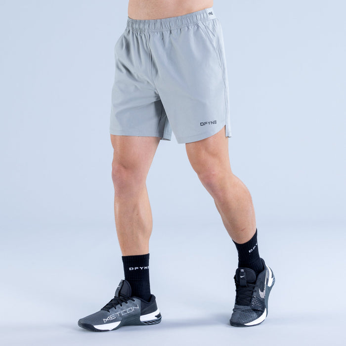 Men's light blue training shorts with elastic waist and DPYNE logo, side view