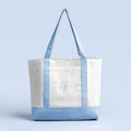 White tote bag with light blue trim and front script graphic
