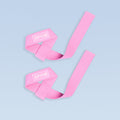 Pink wrist straps with DYNE logo, adjustable wide webbing.