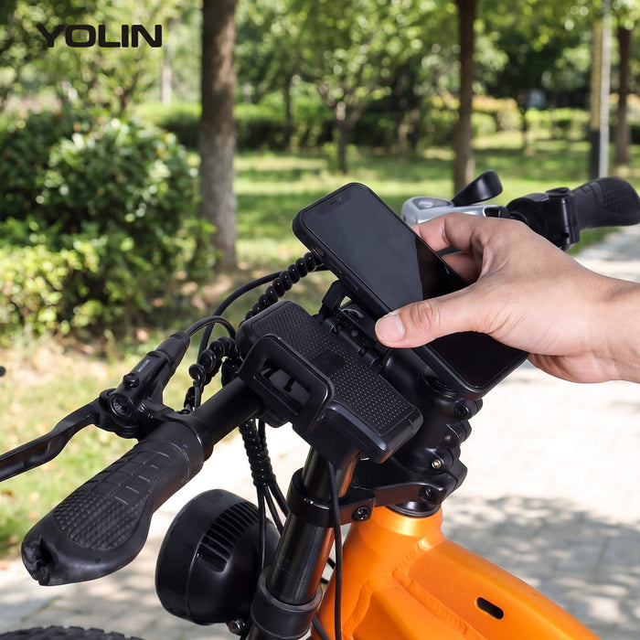 Smartphone placed in Yolin YL-03U e-bike phone mount with USB charging for navigation during ride
